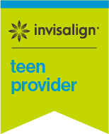 Teen patient holding Invisalign clear aligners at Dorfman Orthodontic Group in Bensalem, PA